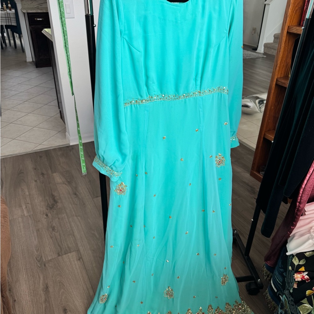Elegant Turquoise Gown with Gold Accents